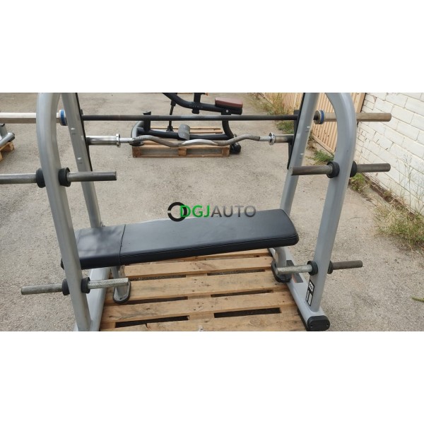 (Envoi nous consulter) 1 Banc de developpé couché allongé occasion Precor avec 1 barre olympique 20kg + 1 barre de bras banc