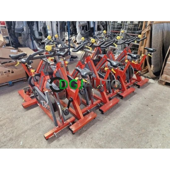 (Envoi nous consulter) Lot 10 velos de fitness biking pro spinning occasion Pulsefitness group cycle orange vendu en l'état